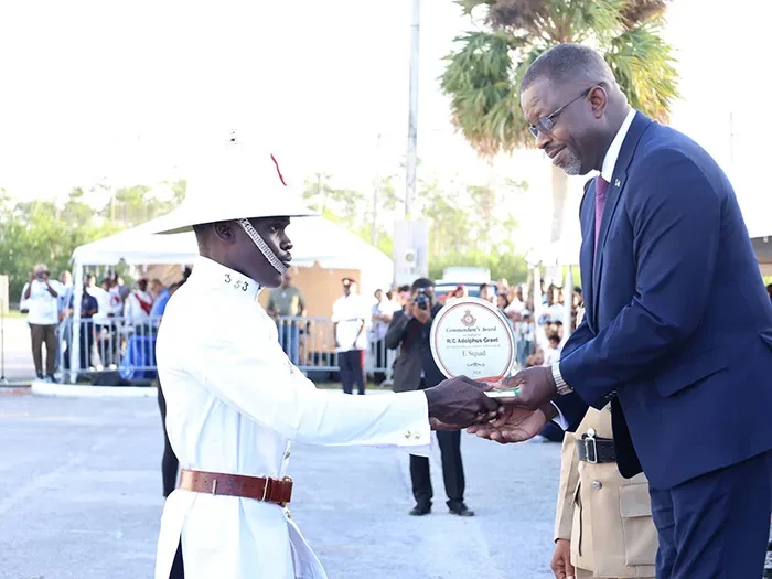 NEW OFFICERS SWORN IN - Ninety-six (96) recruits from the 'D, E & F' Squads graduated at a ceremony held at Grand Bahama Sports Complex under the theme "Stewards of Justice, Empowered to Serve." In attendance were distinguished guests, including the Minister of National Security, the Hon. Wayne Munroe; Commissioner of Police, Clayton Fernander; Assistant Commissioner of Police, Shanta Knowles; Minister for Grand Bahama, the Hon. Ginger Moxey; Parliamentary Secretary within the Ministry for Grand Bahama, Kingsley Smith; along with other esteemed officials, and the family members and friends of the graduates. The ceremony celebrated the recruits' successful completion of six months of intense training. Special awards, including the Commandant’s Award and Baton of Honour, were presented to top performers. <br/>  (BIS Photos/Jamika Culmer)