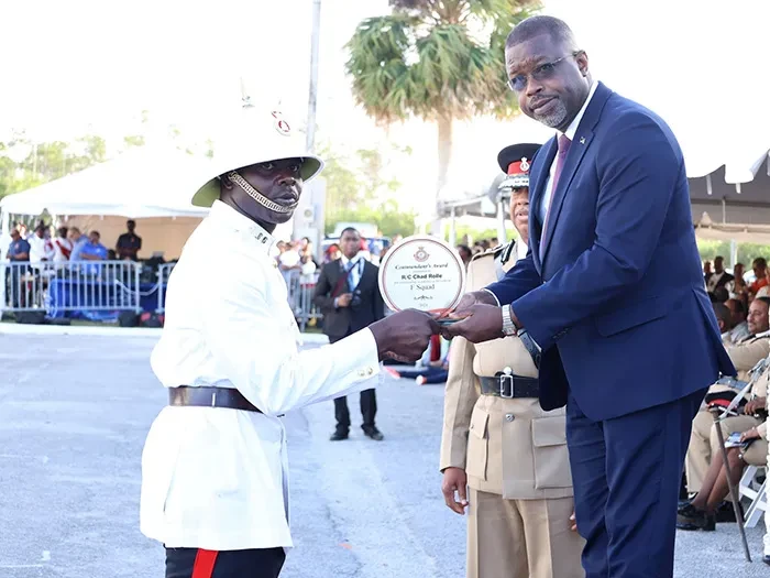 NEW OFFICERS SWORN IN - Ninety-six (96) recruits from the 'D, E & F' Squads graduated at a ceremony held at Grand Bahama Sports Complex under the theme "Stewards of Justice, Empowered to Serve." In attendance were distinguished guests, including the Minister of National Security, the Hon. Wayne Munroe; Commissioner of Police, Clayton Fernander; Assistant Commissioner of Police, Shanta Knowles; Minister for Grand Bahama, the Hon. Ginger Moxey; Parliamentary Secretary within the Ministry for Grand Bahama, Kingsley Smith; along with other esteemed officials, and the family members and friends of the graduates. The ceremony celebrated the recruits' successful completion of six months of intense training. Special awards, including the Commandant’s Award and Baton of Honour, were presented to top performers.  <br/> (BIS Photos/Jamika Culmer)