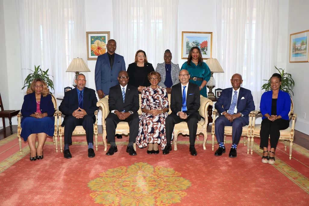 Bahamas Faith Ministries International presents a book to the Governor General