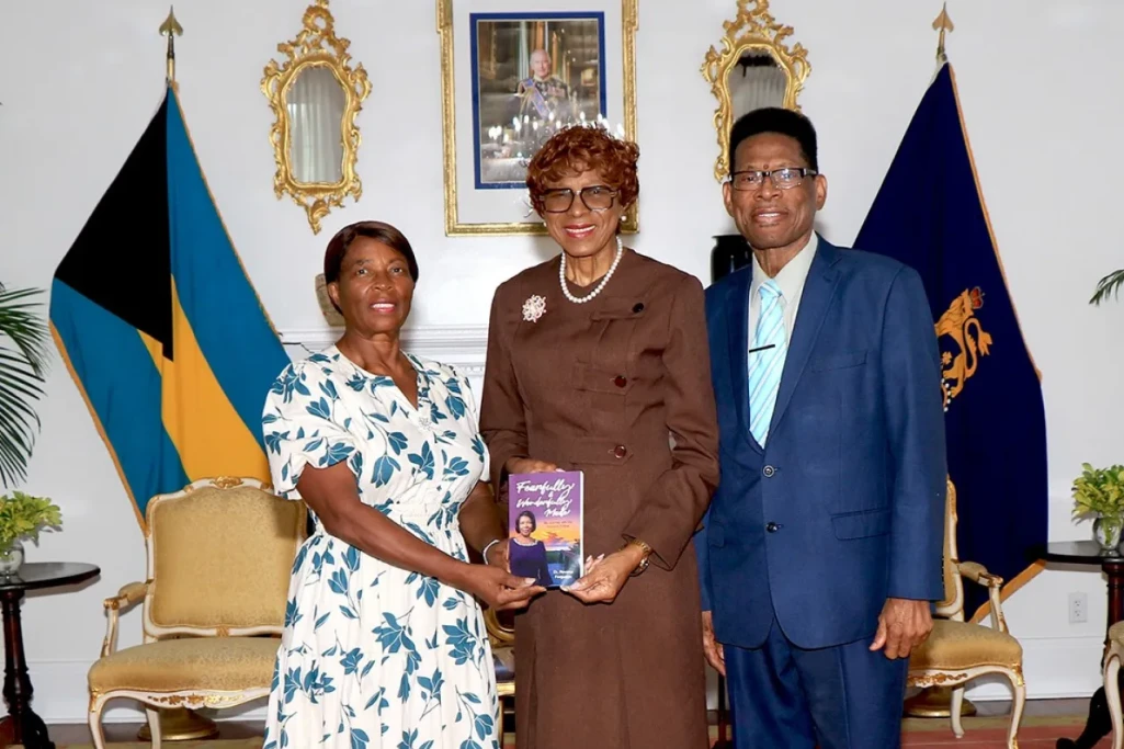 Mrs. Rovena Ferguson presents her book to the Governor General