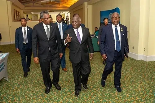 Prime Minister and Minister of Finance, the Hon. Philip Davis (center), along with Minister of Foreign Affairs, Fred Mitchell chat as they enter the ballroom of Grand Lucayan resort, where the 2024 Diplomatic Week officially opened on Tuesday, November 5, 2024.
