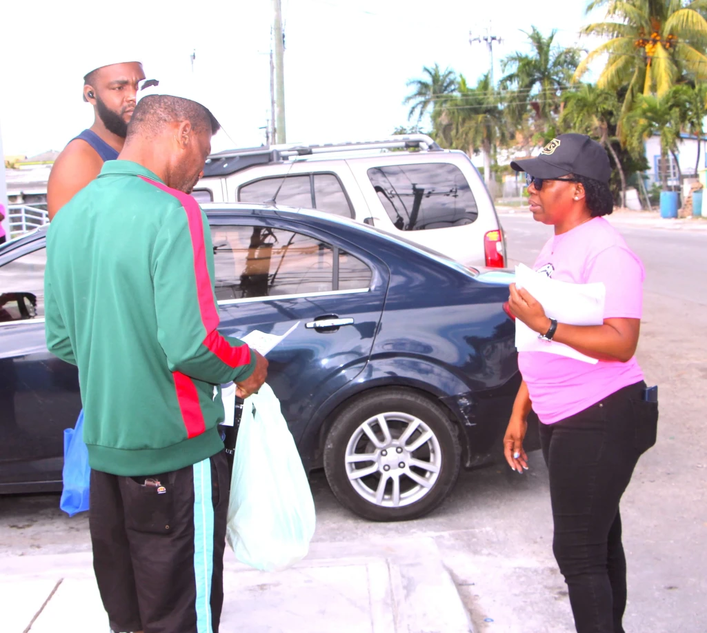 Mrs. Lisa Bowleg, Officer in Charge of Community Affairs, Ministry of Social Services speaks to residents of Nassau Village