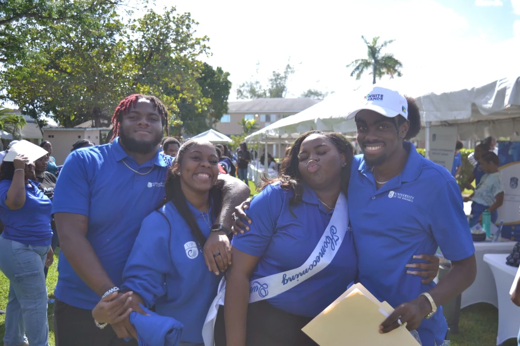 UB Student Ambassadors and Homecoming Queen pose for the camera between interactions with new students