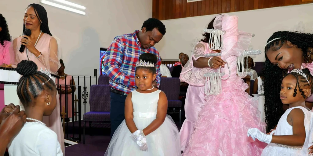 Mrs. Davis applauds 137 girls of Princess Court Mentoring Ministries for taking the sacred purity pledge