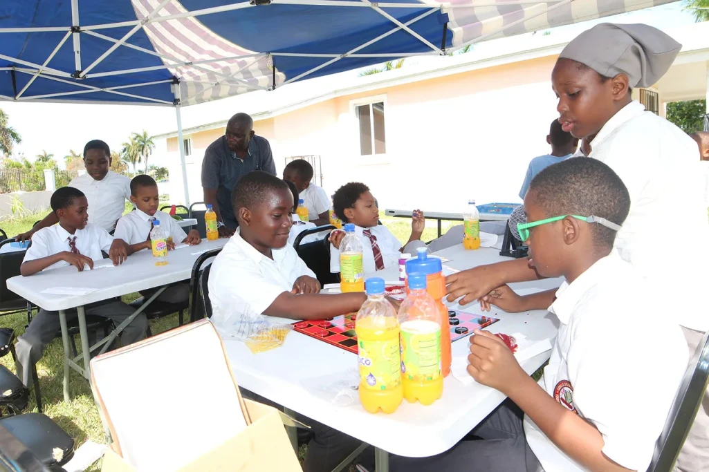 Boys enjoy playing board games, celebrating International Day of the Boy Child