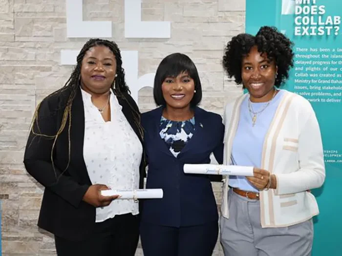 Two employees of Bahamas Information Services North were honoured for their dedication to the public service.  Shown are Anastacia Saunders (left), Administrative Assistant, and Jameka Culmer, Information Officer/Social Media, with Minister for Grand Bahama, the Hon. Ginger Moxey, during a courtesy call at the Ministry on Monday, November 11, held to recognize the honourees.