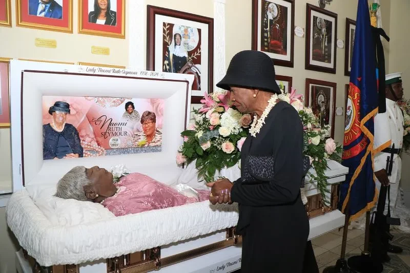 The Deputy to the Governor General pays last respects at Lie-in-State of Naomi Seymour