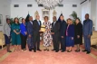 Bahamas Faith Ministries International presents a book to the Governor General