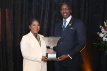 <strong>Ms. Kaché Hanna</strong> receives the 2024 Prime Minister’s Cup from Minister of State in the Ministry of Environment and Natural Resources and Governor-General representative the Hon. Zane Lightbourne; at the recent Nominee Medal Presentation and National Youth Awards Ceremony, held at Evangelistic Temple, on October 29, 2024. <br/> (BIS Photo/Eric Rose)