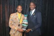 <strong>Navado Dawkins </strong> receives the 2024 Minister’s Cup from Minister of State in the Ministry of Environment and Natural Resources and Governor-General representative the Hon. Zane Lightbourne; at the recent Nominee Medal Presentation and National Youth Awards Ceremony, held at Envgelistic Temple, on October 29, 2024. <br/>(BIS Photo/Eric Rose)